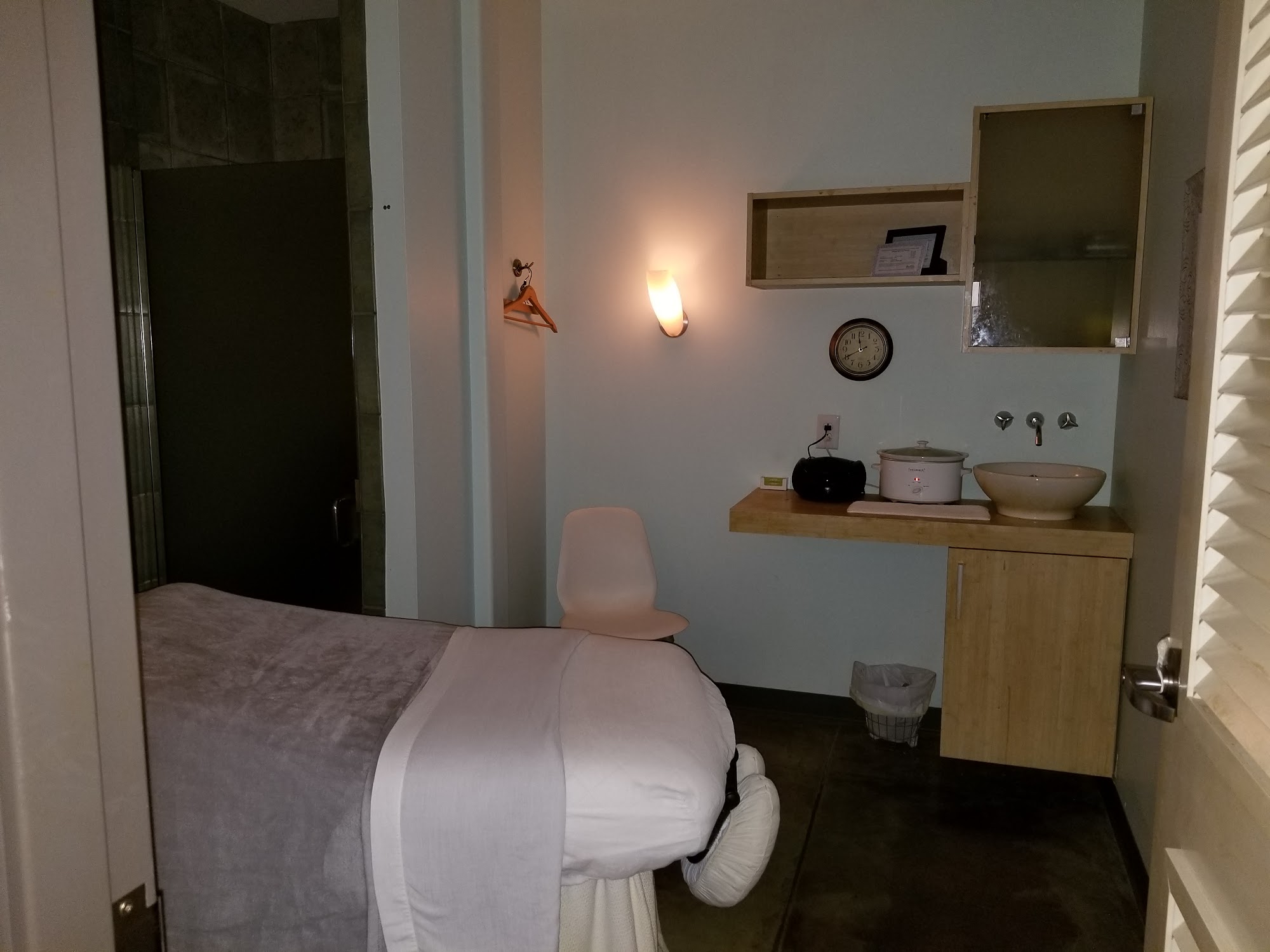 Treatment room with a massage table
